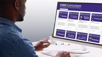 A man looks at the website for the KIND Curriculum.